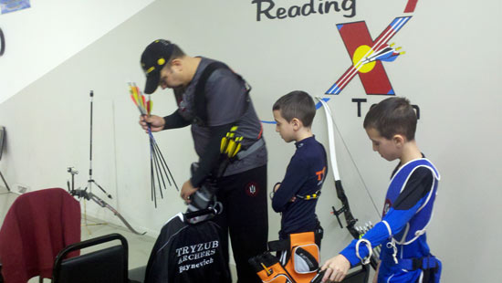 Shooter Coach Ilya Buynevich preps his twin sons, Osar and Oliver, for their first tournament
